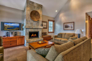 living room with rock fireplace 18